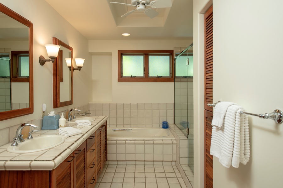 Second bathroom w/dual vanity, soaking tub & walk-in shower.