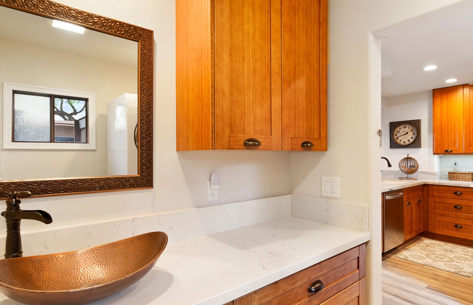 A stylish bathroom vanity with warm wood tones and a polished design for a touch of elegance.