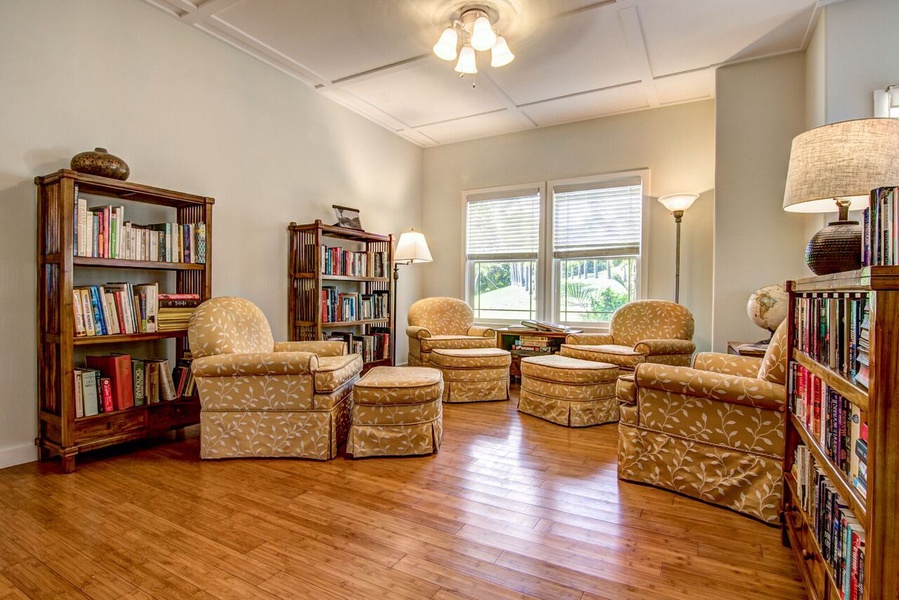 Reading room with 4 comfy charis and ottomans to relax and read the day away!