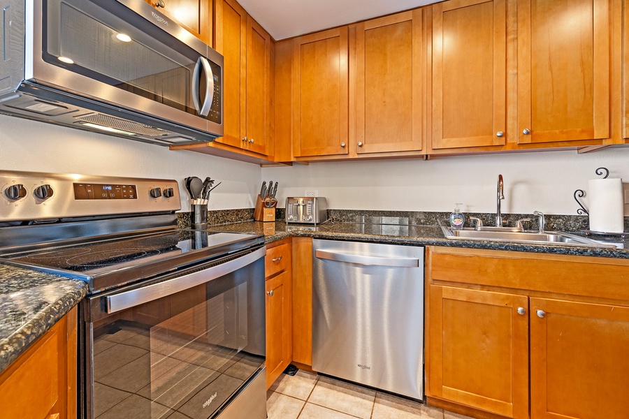 This modern kitchen is equipped with stainless steel appliances, sleek cabinetry, and everything you need to prepare meals during your stay.