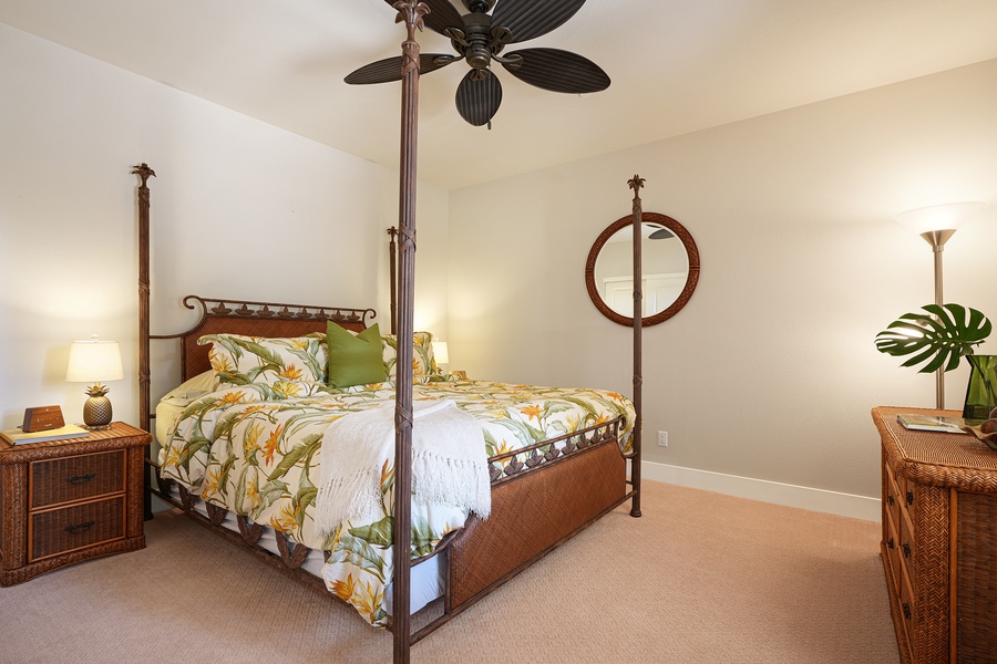 Primary guest bedroom with a classic four-poster bed for a restful night's sleep.