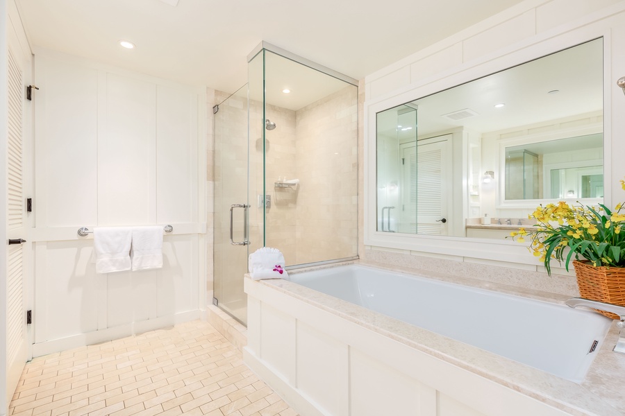 spa-quality bathroom complete with a deep soaking tub, separate shower, and dual-sink vanity.