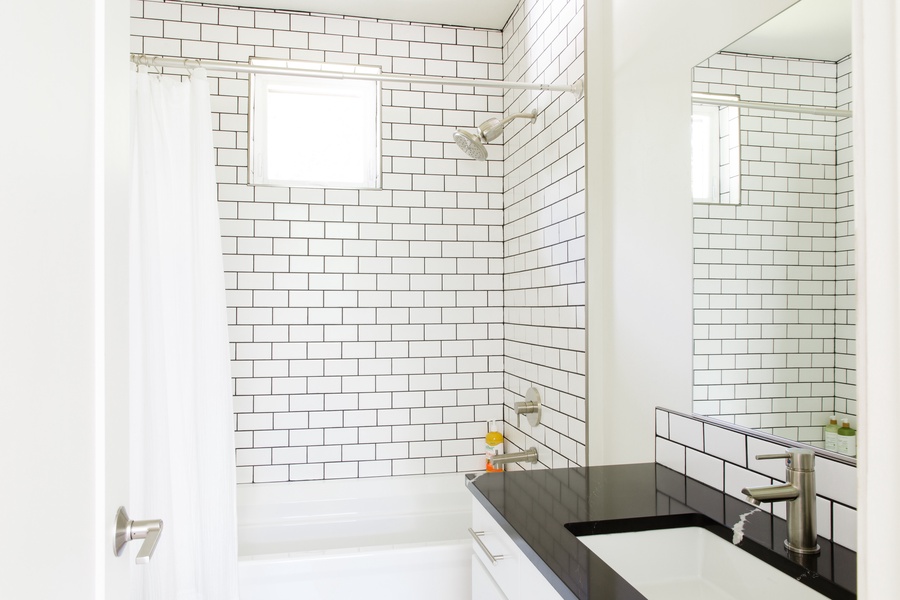 Full bathroom with a tub and shower