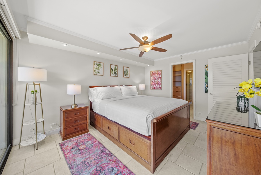 Wake up to panoramic views of the Pacific from a spacious, well-appointed primary bedroom with a king-sized bed.