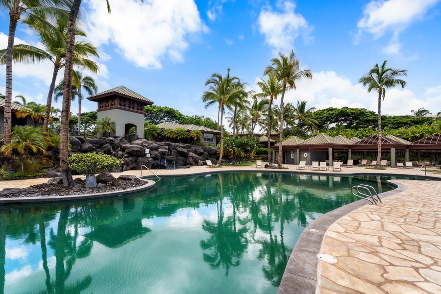 The shared pool area with tropical landscaping.