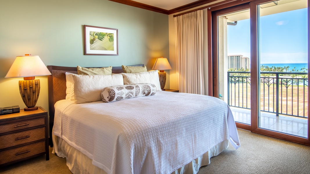 The primary guest room is tastefully decorated with peaceful views.