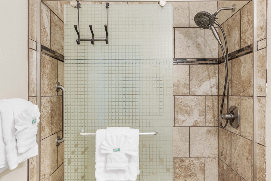 Sleek ensuite bathroom with a spacious walk-in shower – an invigorating start to your day.