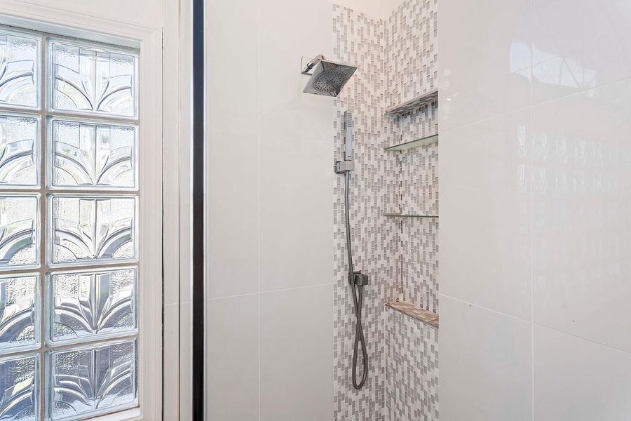 Walk-in shower in a glass enclosure