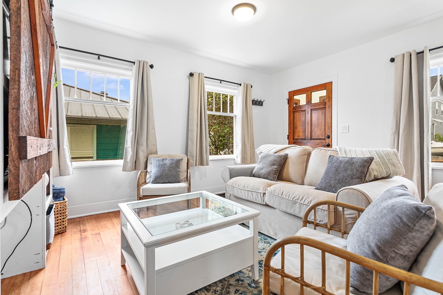 Gather with friends or family in this light-filled living room featuring soft textures and smart home touches.