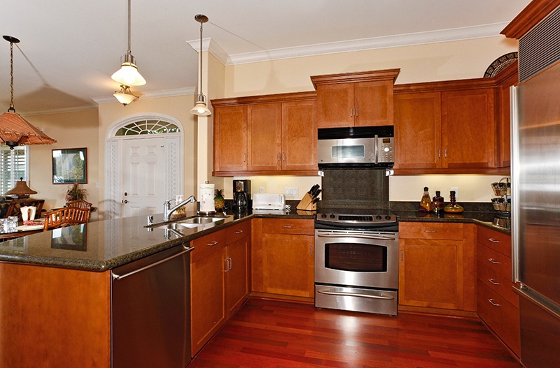 The beautiful kitchen with stainless steel amenities.