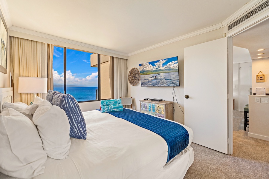 Wake up to ocean views from Kaanapali Shores 903’s bedroom with lanai access.
