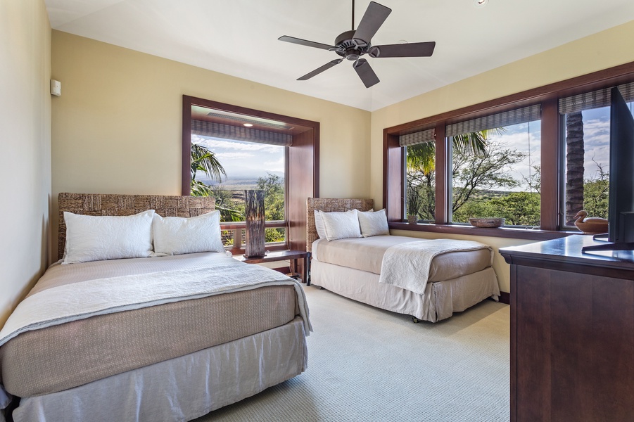 Third bedroom, with two full beds and large flat-screen TV.