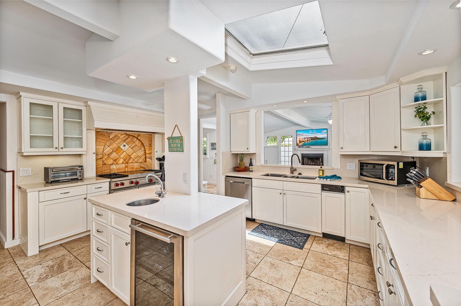 Open concept chefs kitchen with top of the line appliances.