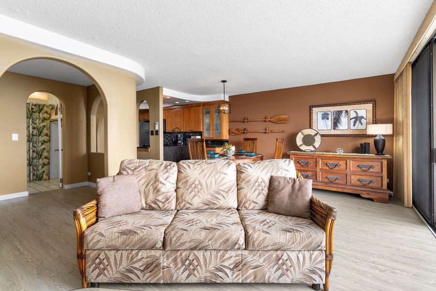 Spacious living area with open flow to kitchen and lanai.