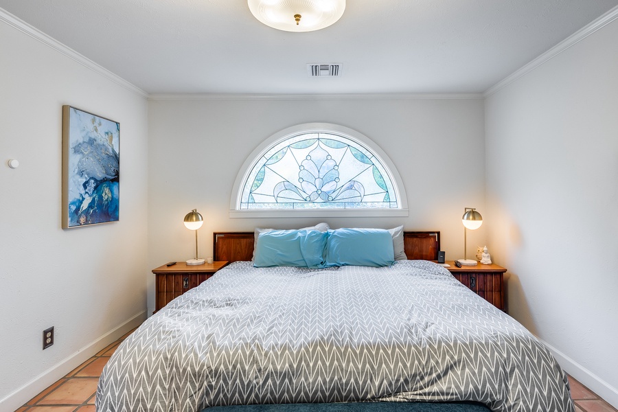 Retreat to our cozy, warm primary bedroom, a personal sanctuary designed to provide restful nights and peaceful mornings.