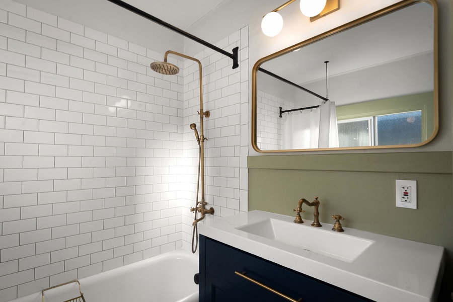 Unwind after exploring Bellingham in the soaking tub with classic tile and brass accents.