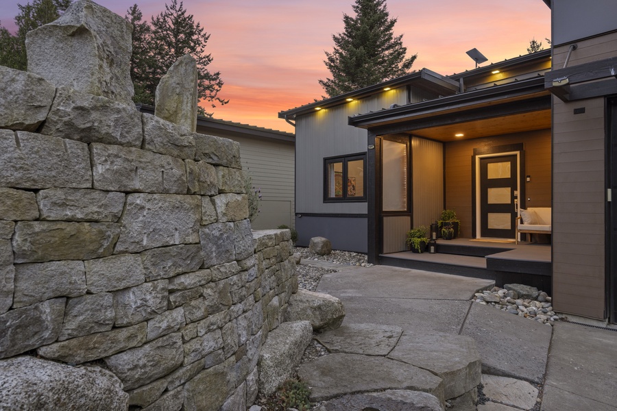 Stone pathway and soft lighting welcome you back to your coastal retreat after a day exploring Bellingham Bay.