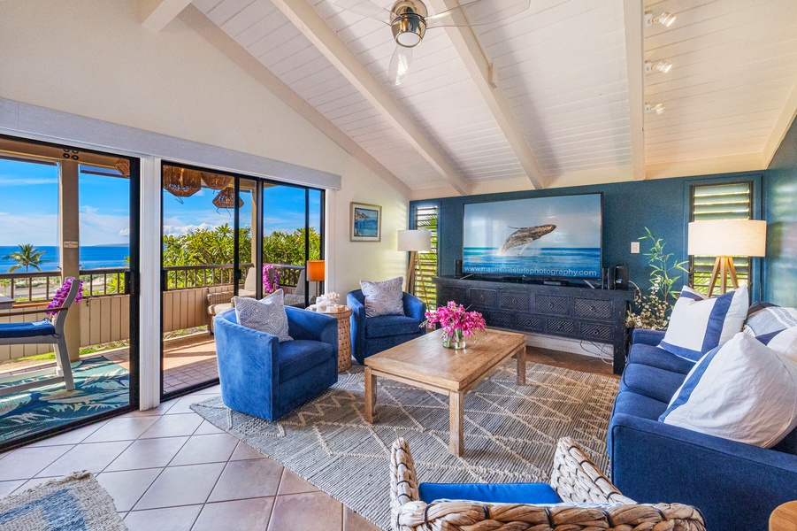 Relax at Wailea Ekolu 1106 in the spacious living room with vaulted ceilings and island decor.