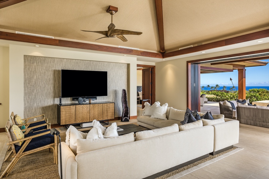 The living area’s wraparound plush seating, inset entertainment wall with 75” smart flat screen TV and Sonos audio system provide entertainment perfection.