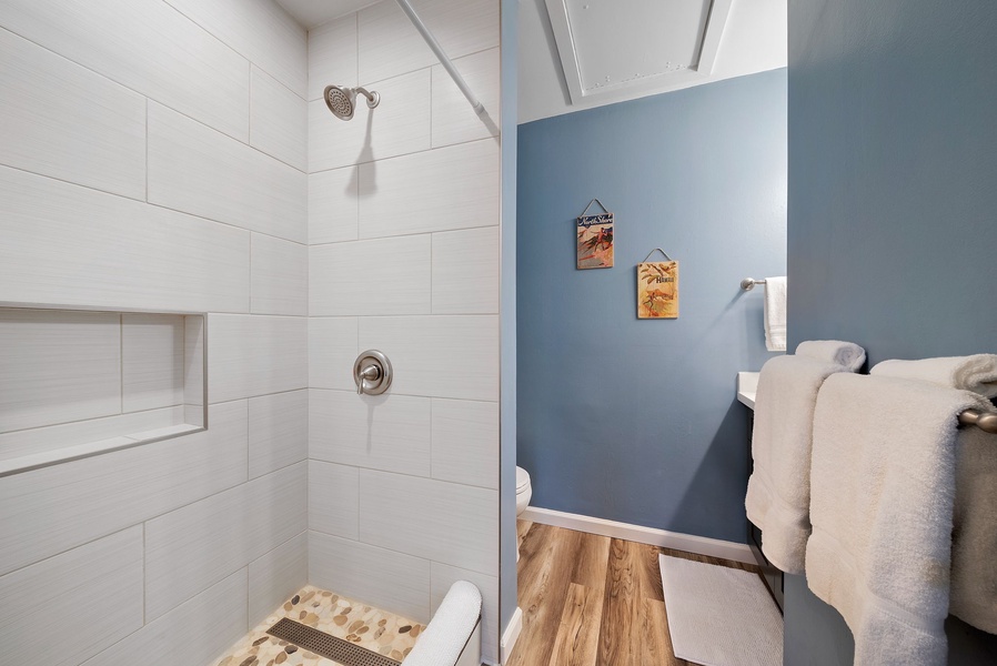 Primary bedroom ensuite with custom tiled shower.