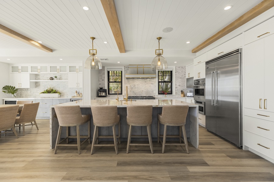 A wine cooler and an expansive wet bar for entertaining guests while cooking up some delicious culinary delicacies, and enjoy your meals at the formal indoor dining table that seats 8.