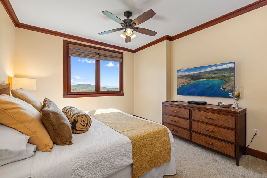 Primary bedroom with king bed and TV.
