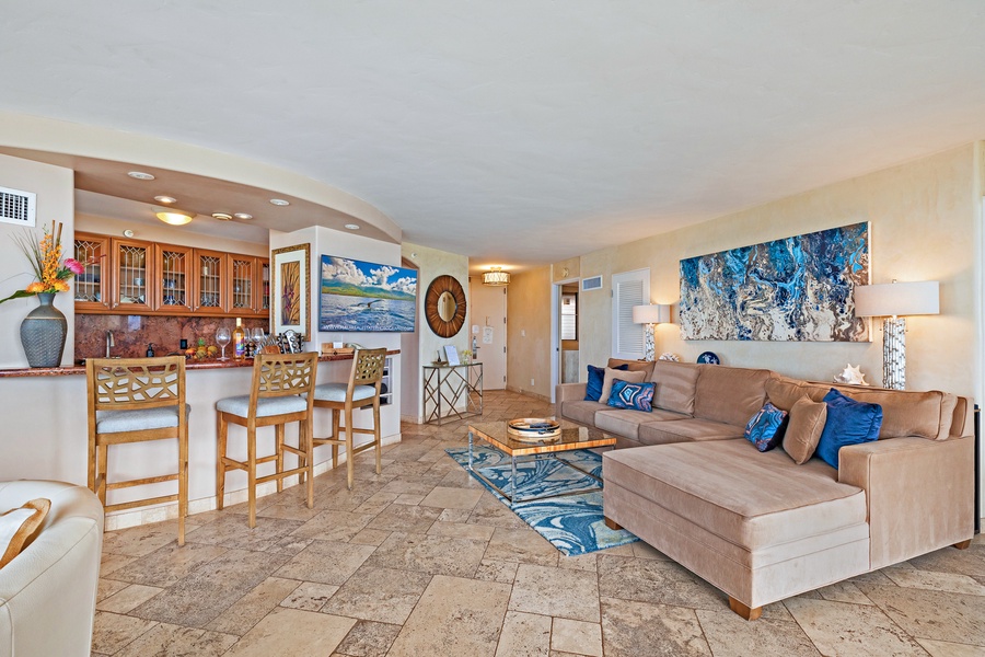 Royal Kahana 610's living area flows seamlessly into the kitchen and dining space, offering a cozy atmosphere for relaxing or enjoying meals together.