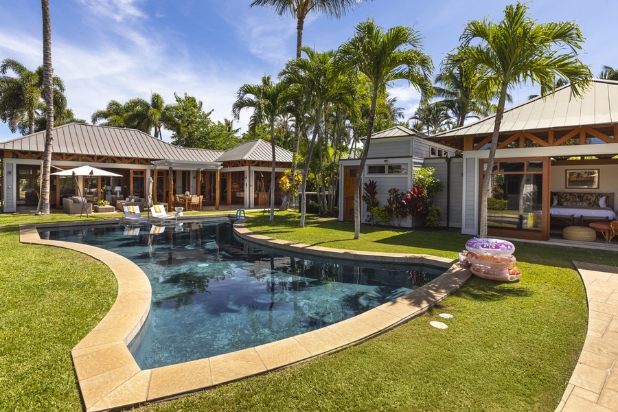 Sun loungers by the poolside offering a perfect way to relax and enjoy the island breeze.