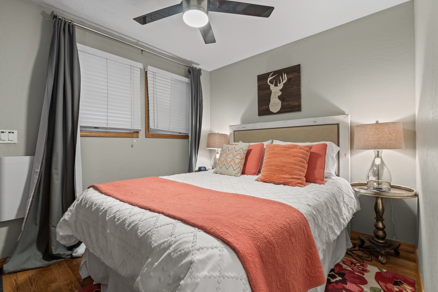 The queen bed in the guest bedroom offers direct access to the backyard and a full closet, ensuring that you have everything you need for a comfortable stay