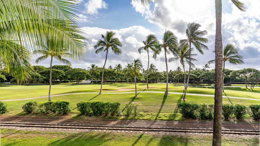 Lush greenery and manicured lawns surrounding the condo.