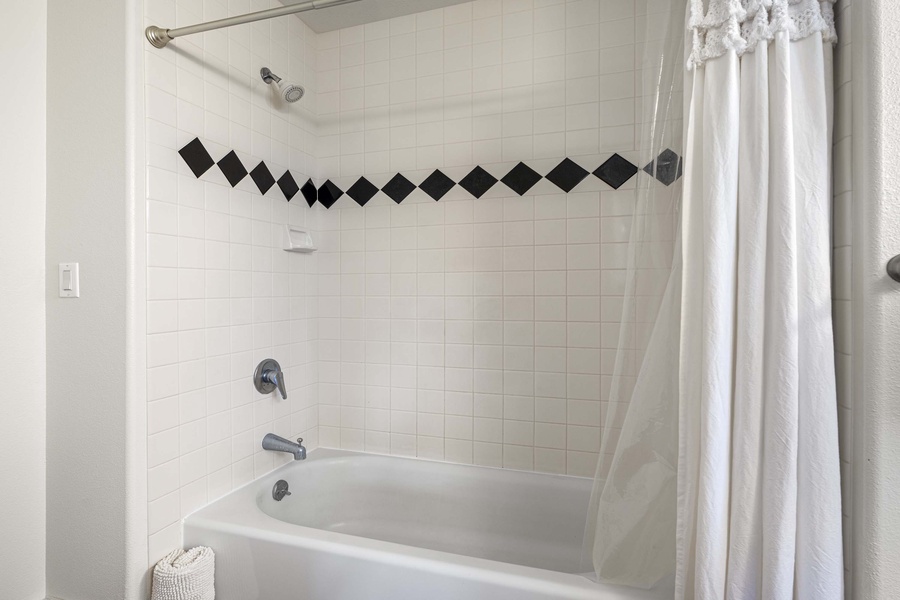 Tub shower combo in the Jack and Jill bath