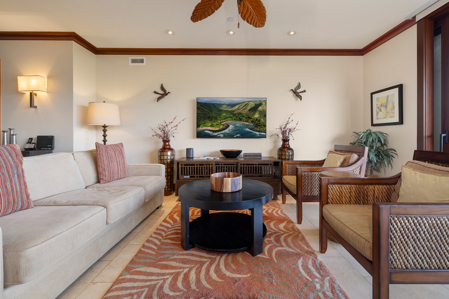Cozy up in the living room surrounded by natural light and tropical warmth.
