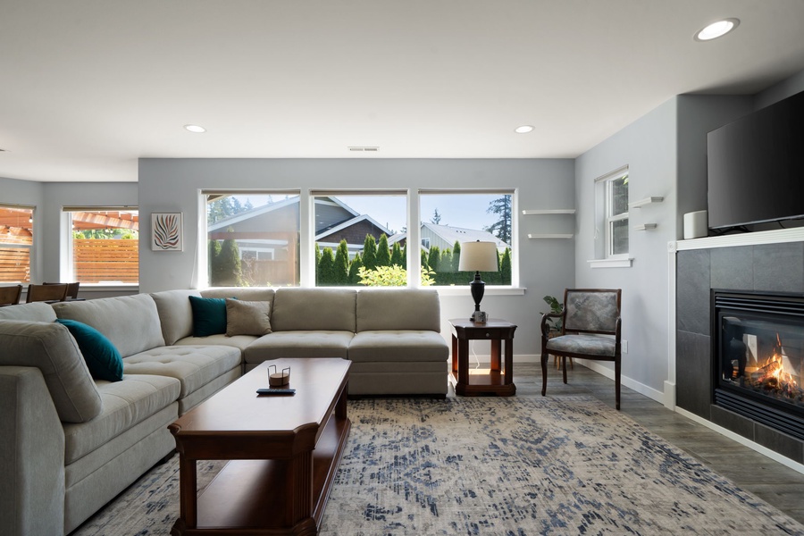 Natural light fills the welcoming living space, where comfortable furnishings and an open layout make it easy to relax together.