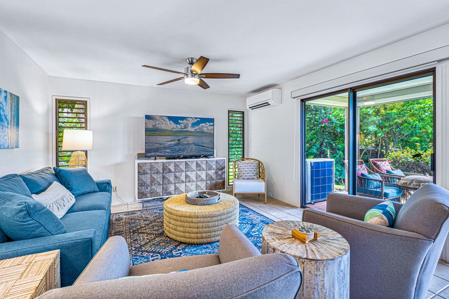Cozy living room at Wailea Ekolu 1605 with garden views and seamless indoor-outdoor living.
