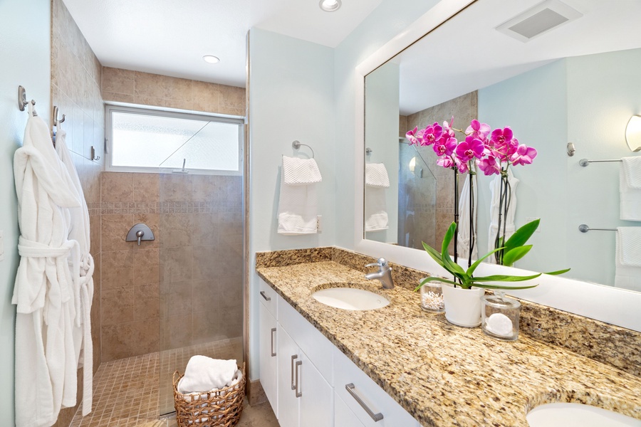 Guest ensuite with a walk-in shower in a glass enclosure.