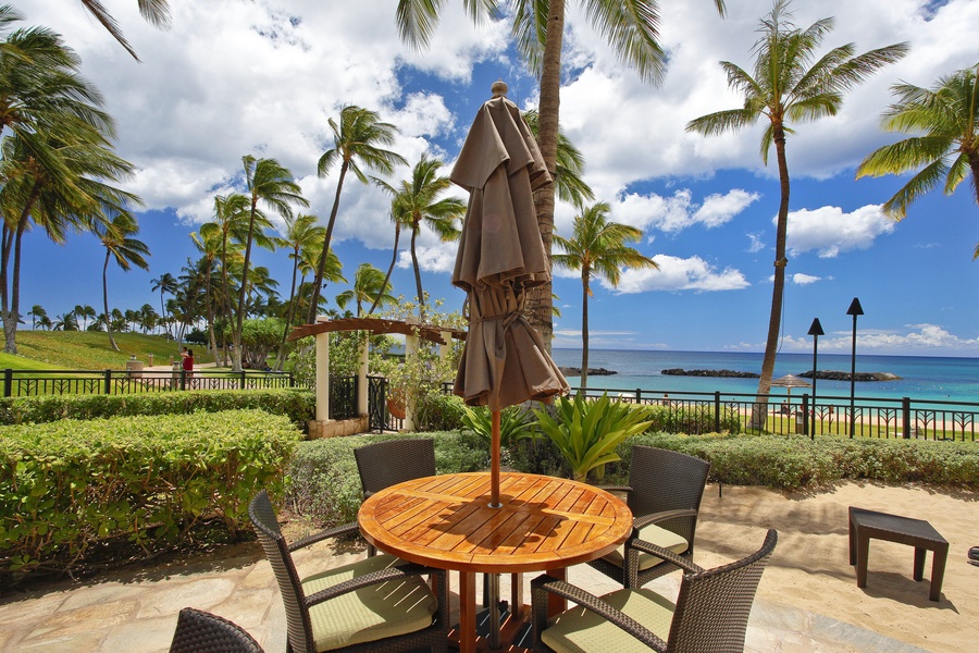 Dreamy white clouds floating happily over a resort dining area.