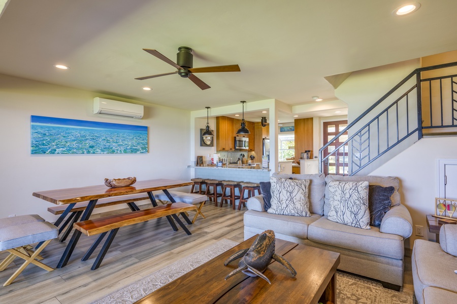 Beautifully furnished interior with natural light flowing through large windows.