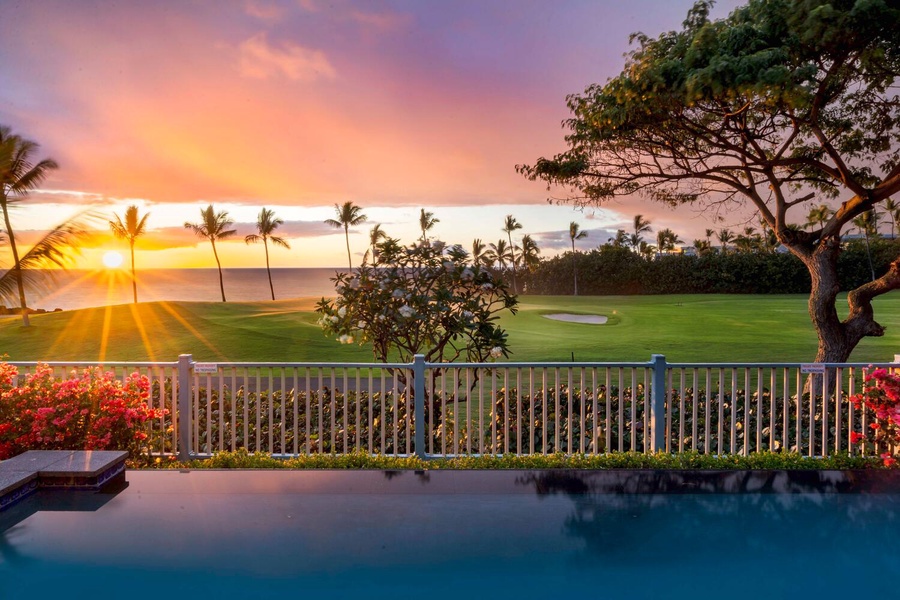 Dreamy sunset over a tranquil golf course and ocean horizon.