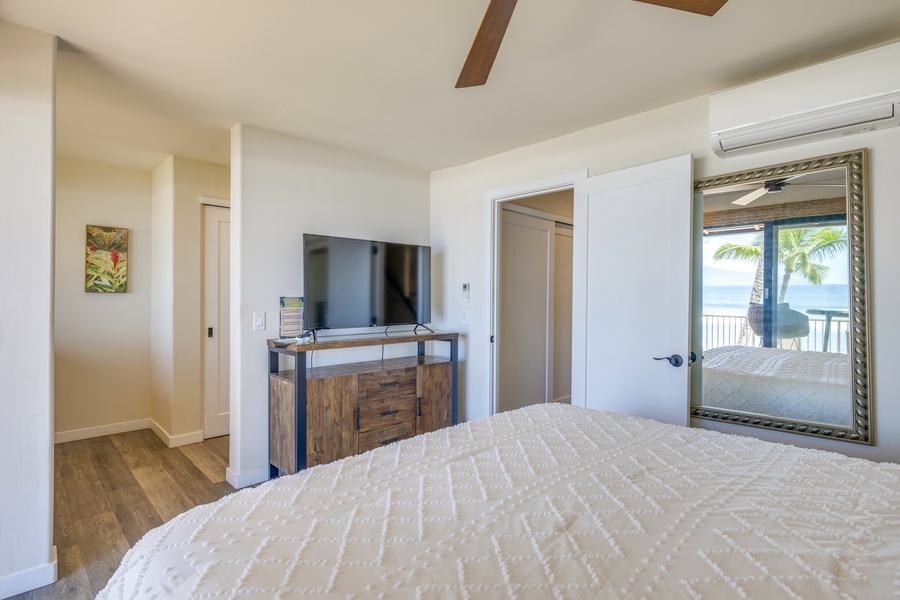 Wake up to soothing ocean views from the comfort of a cozy Primary bedroom.