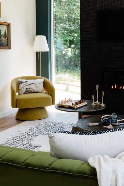 Cozy areas to visit in front of the dramatic fireplace.