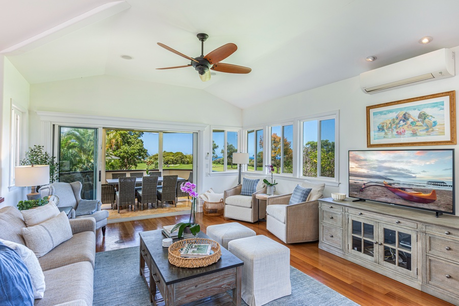 Light-filled living space with seamless flow to kitchen and dining areas, ideal for relaxed island living.