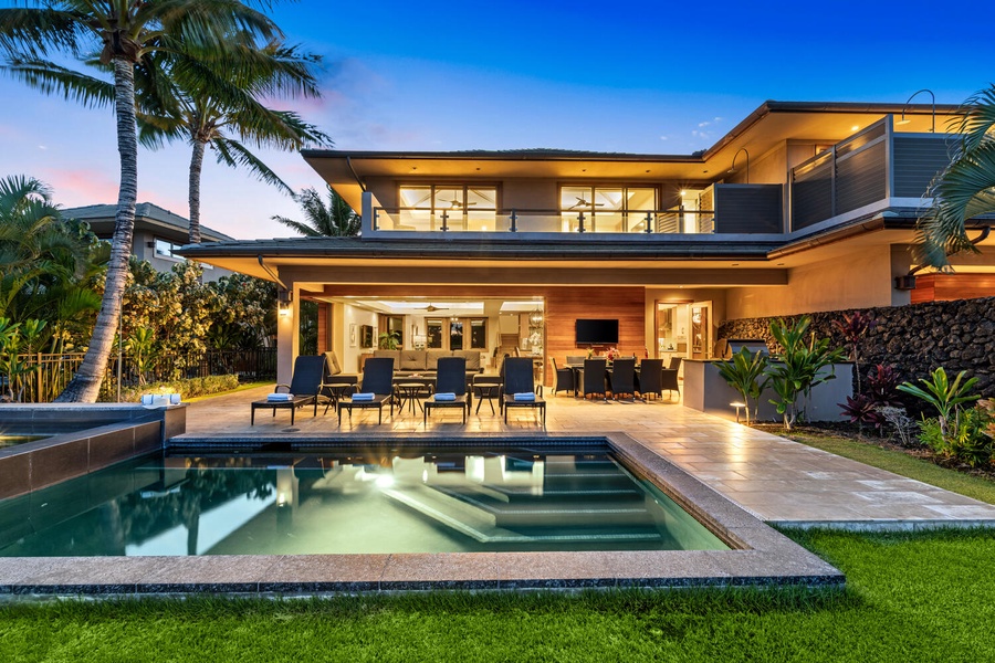 Evenings glow at this resort-style villa with a poolside lanai for entertaining.