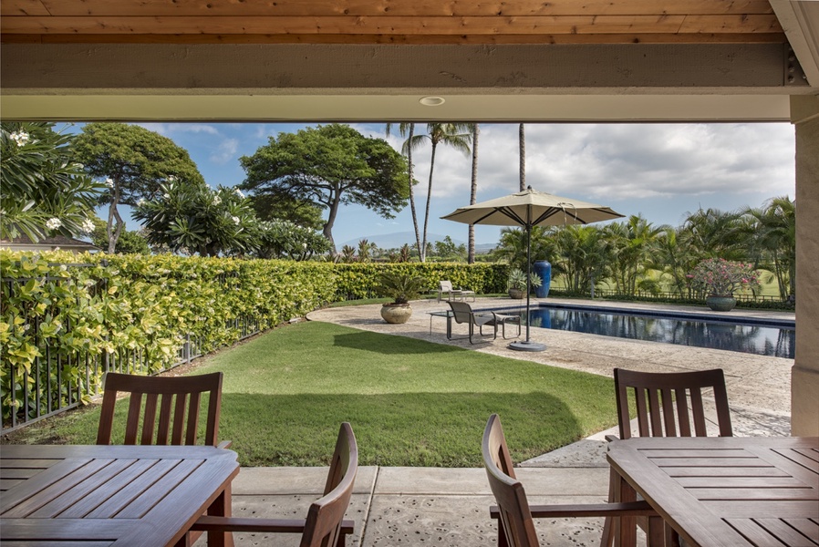 The community pool offers lounging, and covered seating areas.