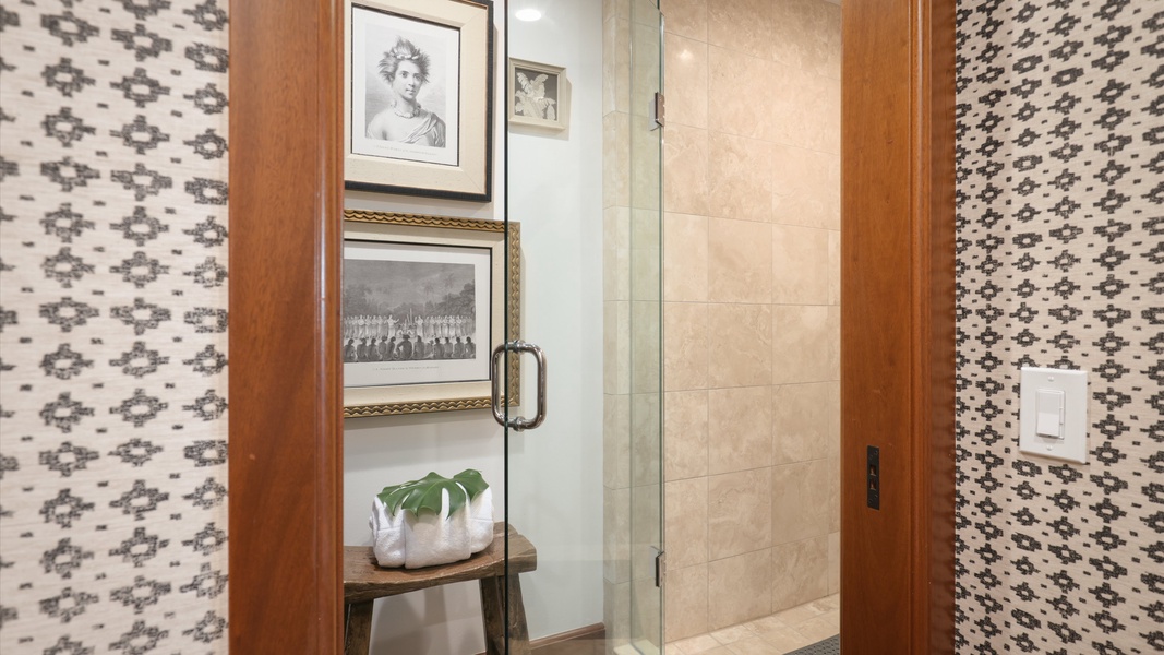 Glass walk-in shower with natural tones and clean, modern lines.