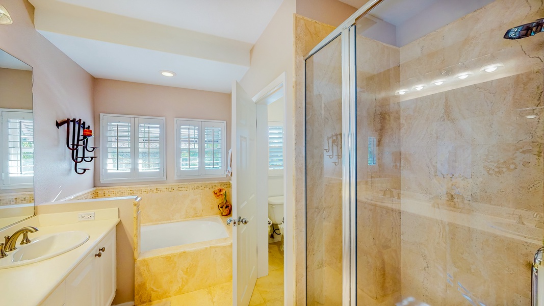 The spacious primary guest bathroom with walk-in shower.