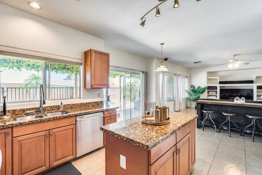 From the kitchen walk right outside to the yard/pool area