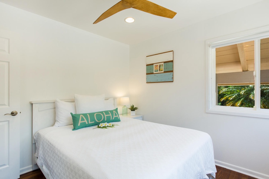 Bedroom 3, Queen bed with nice, clean aloha design.