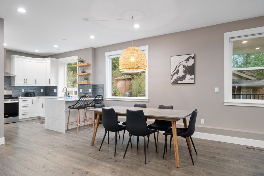 Your stylish dining space flows seamlessly into the modern kitchen, creating the perfect spot for memorable meals together.