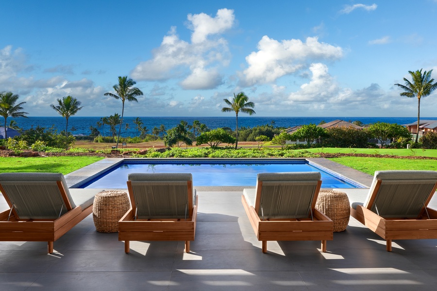 Unwind on the lanai at Hiki Moe with ocean views and lounge chairs perfect for soaking up the sun.