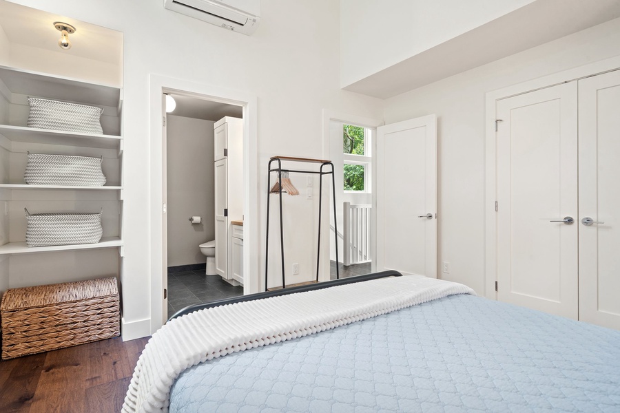 This cozy bedroom is tucked away upstairs for a quiet night’s sleep.